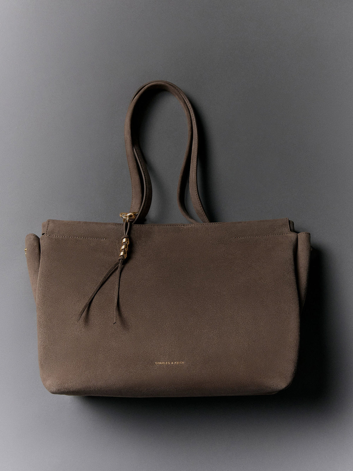 CHARLES & KEITH Deals / XL Zephyr Tassel Tote Bag - Stone Grey