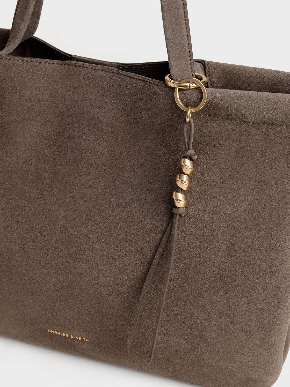 CHARLES & KEITH Deals / XL Zephyr Tassel Tote Bag - Stone Grey