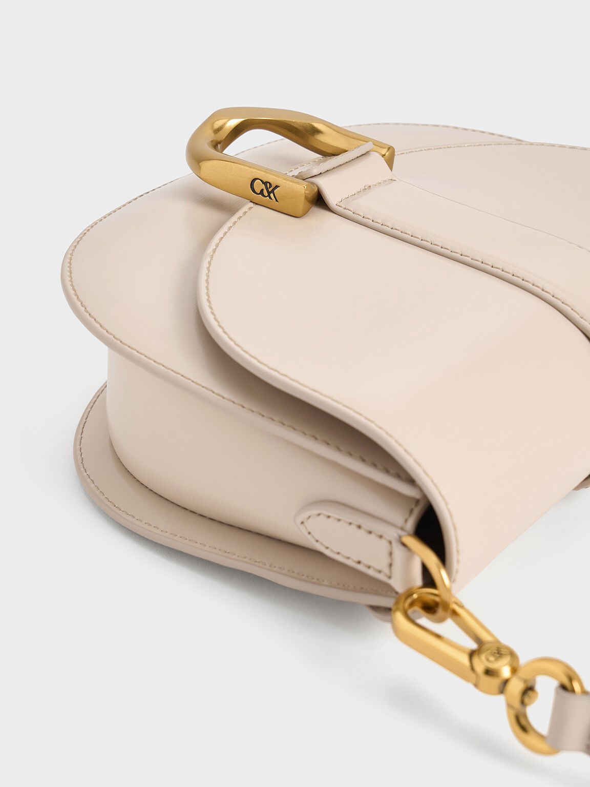 CHARLES & KEITH Hot Sale / Gabine Leather Saddle Bag - Oat