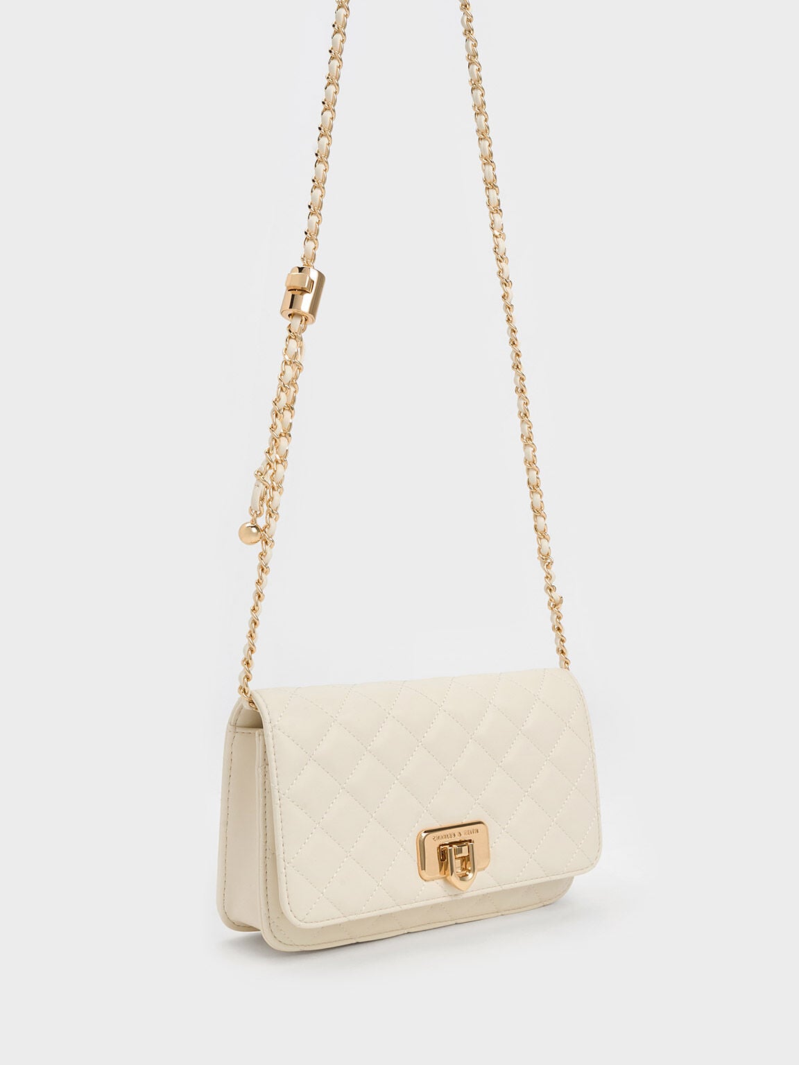 CHARLES & KEITH Customer Favorite / Cressida Quilted Push-Lock Clutch - Cream