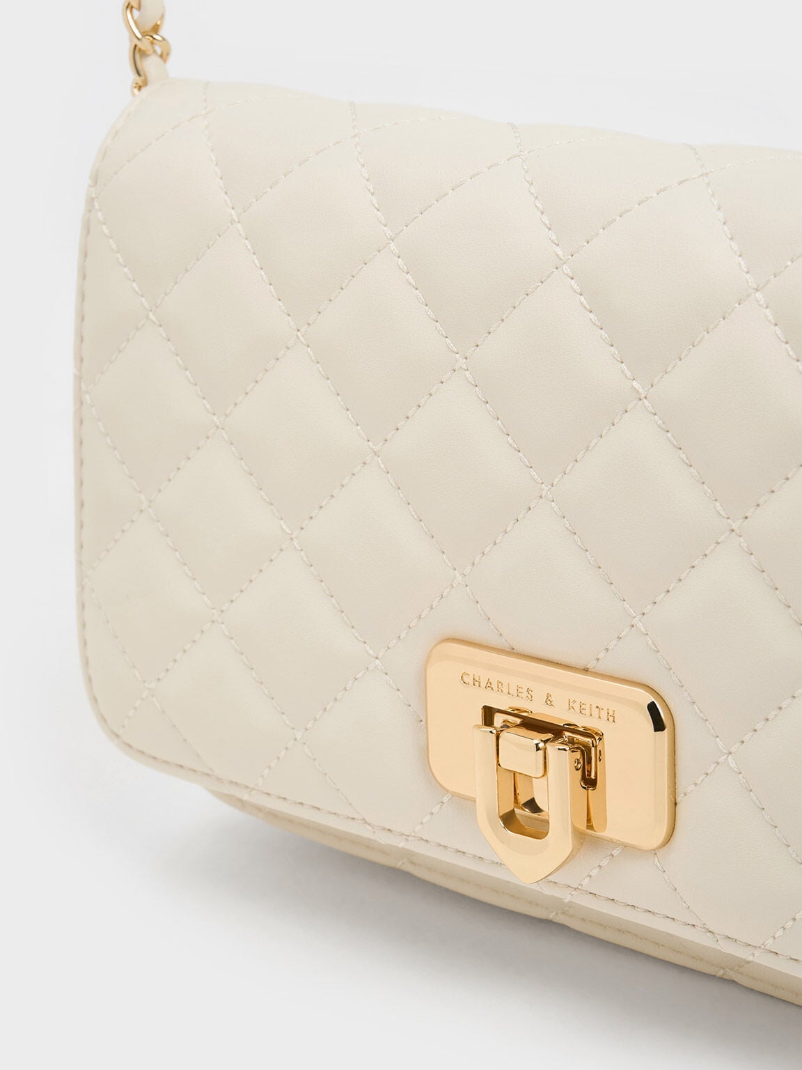 CHARLES & KEITH Customer Favorite / Cressida Quilted Push-Lock Clutch - Cream