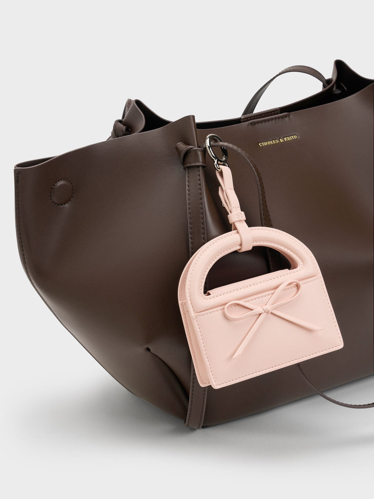 CHARLES & KEITH Customer Favorite / Reese Bow Top Handle Wristlet - Soft Pink