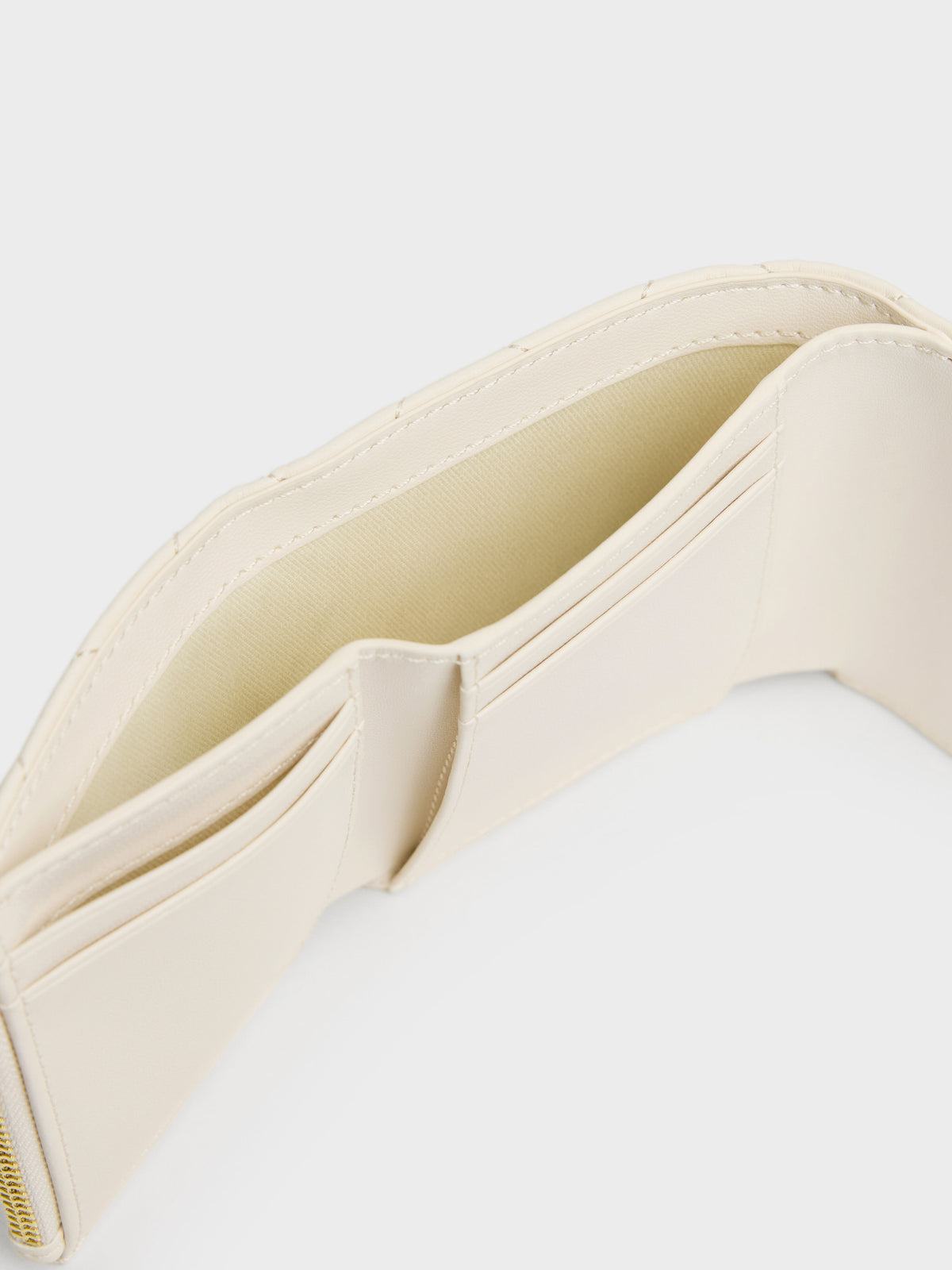 CHARLES & KEITH Premium / Arrietty Quilted Curved-Flap Wallet - Cream